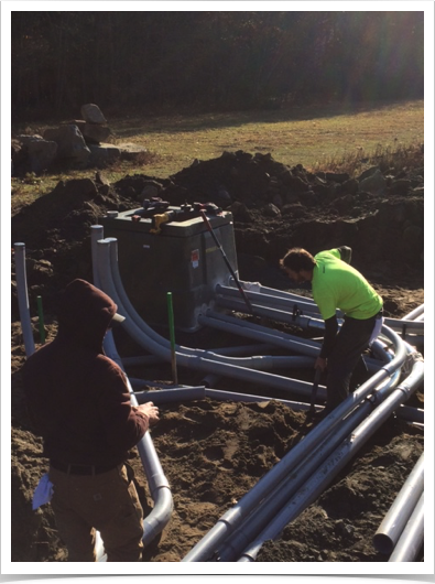 commercial electrical contractor in the upper valley working on an exterior electrical junction box