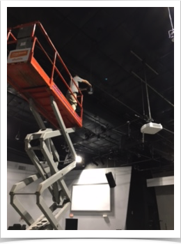 electrician working on an electrical lighting system